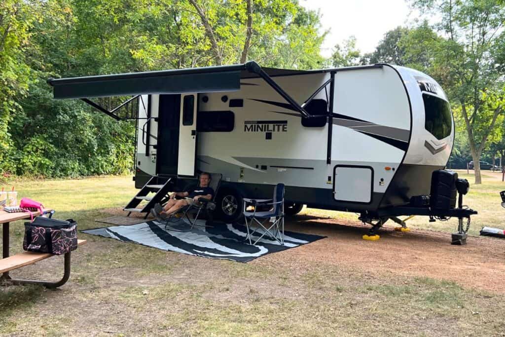 RV Campsite with Travel Trailer and Camping Chairs